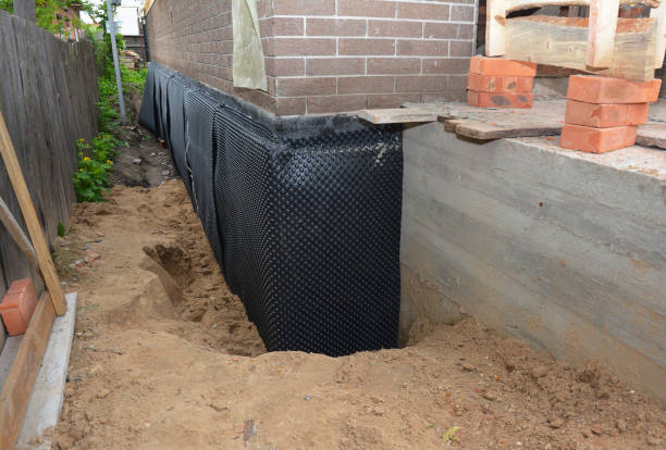 SJ Waterproofing Pros technician performing targeted Interior Drainage System assessment in Plymouth, MI